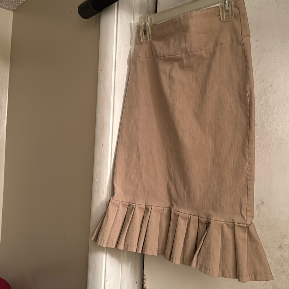 Tan pencil skirt with ruffled edges at the bottom